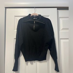 Black sweater, gold zip